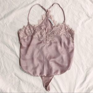 Lightly worn purple bodysuit